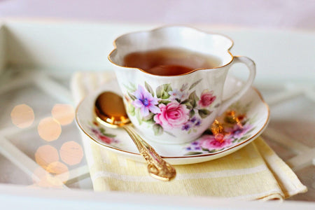 white china tea cup with flower