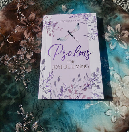 a book of psalms in purple and  lavender colors  pocket book size