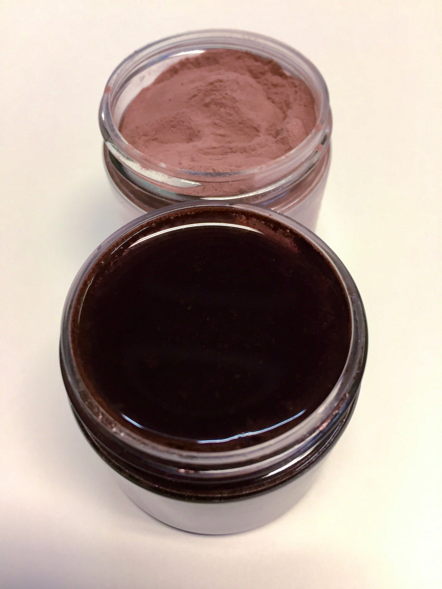 picture of  pinkish brown powder  and the  deep  black purple reconstituted juice that is made from this product