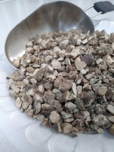 picture of stone root pieces on a plate, the root is a tan to light brown