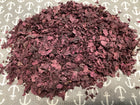 dry red seaweed on a gray and white bakground