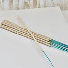 pretty incense sticks of beigh and green