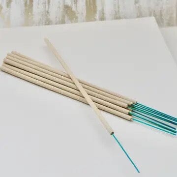 pretty incense sticks of beigh and green